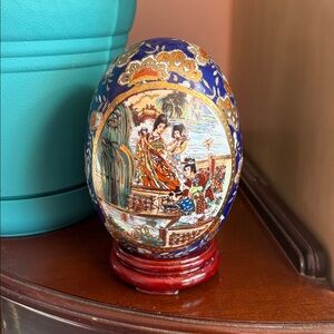 Artistic Blue and Gold Ceramic Egg by [Brand]